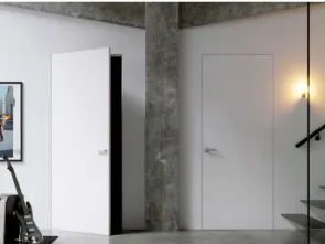 Porta battente per interni in laccato bianco come la parete Gea Filo muro di Doal